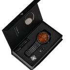 Watch and pen set in a black box with 'TOM' branding on a white background