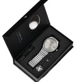 Watch set with silver watch, bracelet, and pen in a black box on a white background