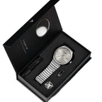 Watch set with silver watch, bracelet, and pen in a black box on a white background