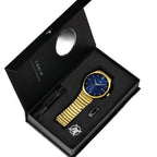 Watch and pen set in a black box with TOMY branding