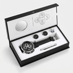 Luxury watch and cufflink set in a branded box on a white background