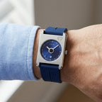 Man wearing TOMI T022 Summit Eternal watch with blue dial and blue silicone strap