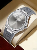 TOMI T051 silver watch with leather strap on wood surface