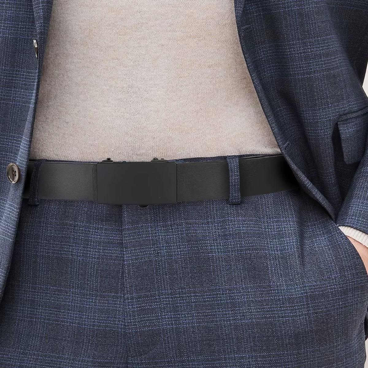 Close-up of a person wearing a navy suit with a black belt.