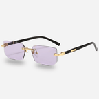 Sunglasses with gold frame and black arms on a white background