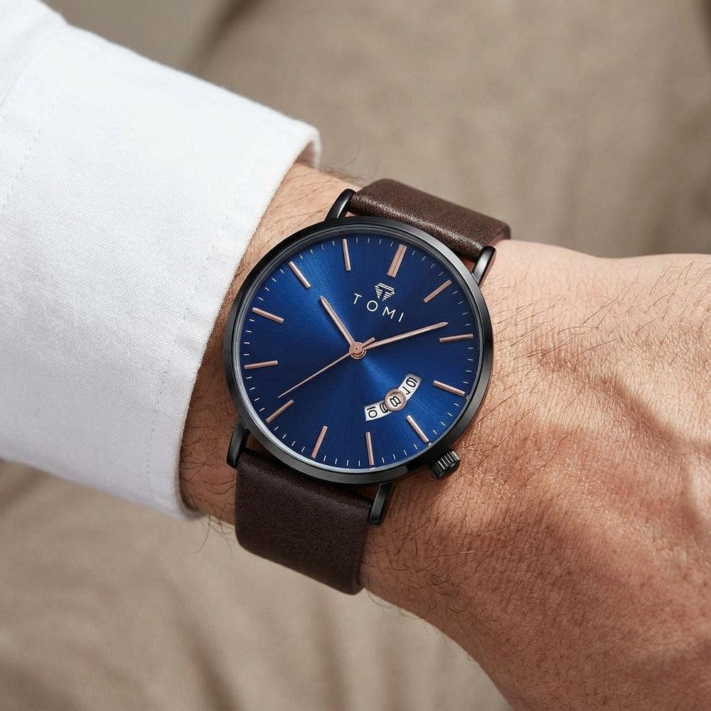 Man wearing TOMI T018 Enigma Splendor watch with blue dial and brown leather strap
