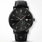 Black watch with black leather strap on a white background, front view