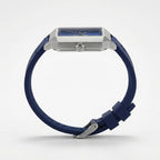 Blue watch with silver case, side profile view