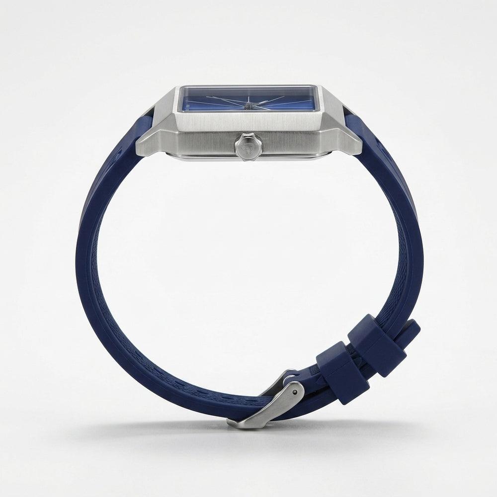 Blue watch with silver case, side profile view