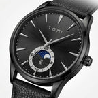 TOMI T024 Phantom Radiance watch with black dial and black leather strap, macro close-up