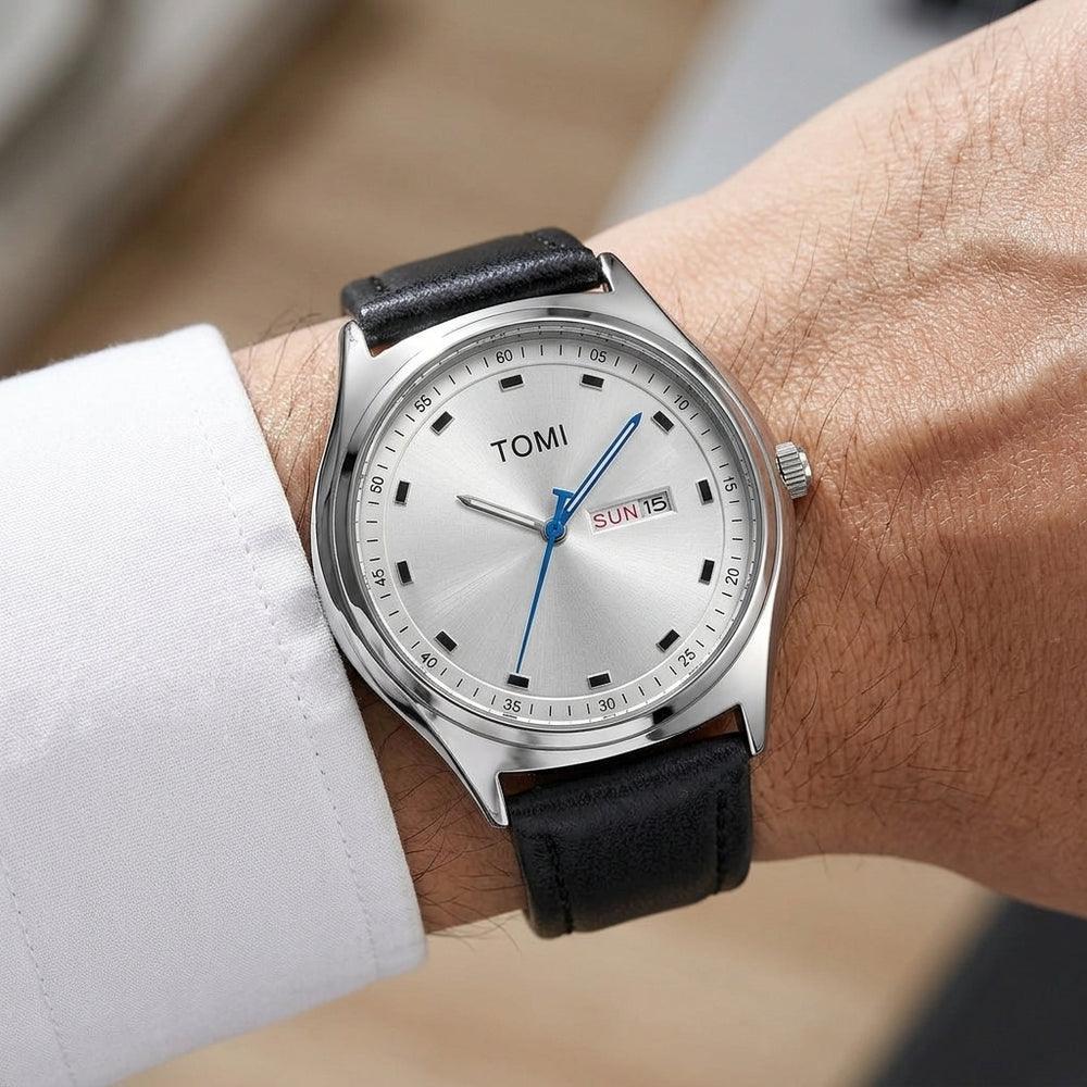 Man wearing TOMI T030 Obsidian watch with silver case and black leather strap