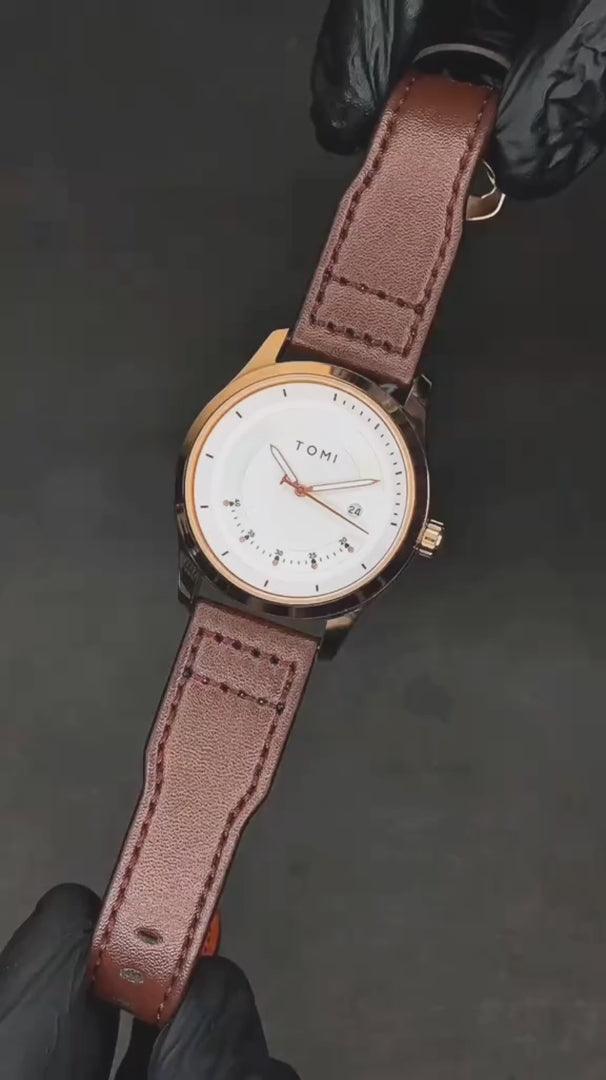 TOMI T099 Perpetual Icon watch with white dial, rose gold case, and black leather strap
