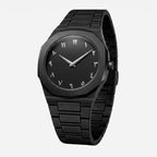 Black watch with a metallic strap on a light gray background.